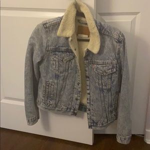A denim jean jacket with Sherpa inside